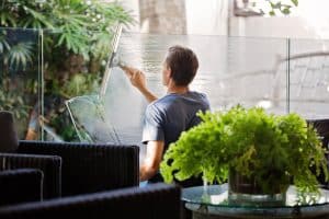 Man washing windows: what's included in commercial cleaning